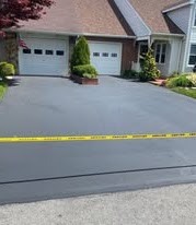 Twin-garage driveway after sealcoating