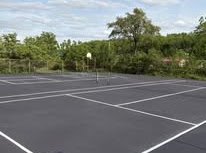 Sport court parking area after sealcoating and striping
